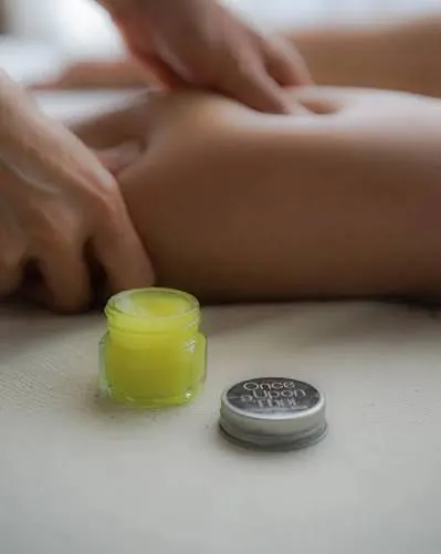 Herbal Thai balm massage in Dubai — warming balm for muscle pain relief